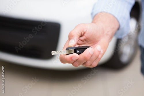 Close up of customer holding his new car key