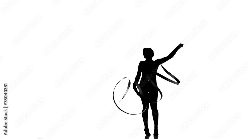 Silhouettes Gymnastic stunt with ribbon, slow motion Silhouettes Gymnastic stunt with ribbon, slow motion