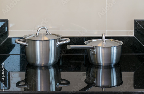 stainless pots in modern kitchen