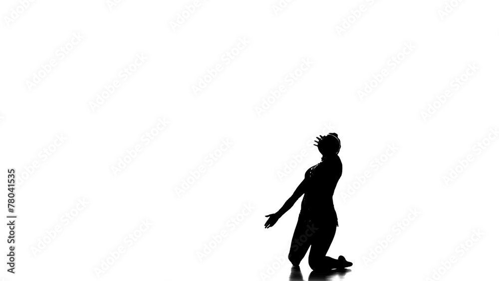 Silhouettes Gymnast plays with a ball, nice trick, white and Silhouettes Gymnast plays with a ball, nice trick, white and