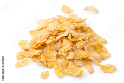 Closeup of heap of corn flakes cereals , isolated on white