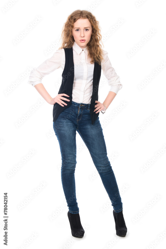 Portrait of young business girl with curly hair in jeans