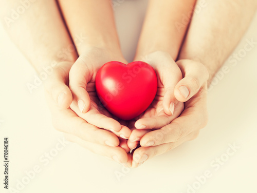 woman and man hands with heart