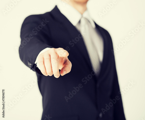 man pointing his finger at you