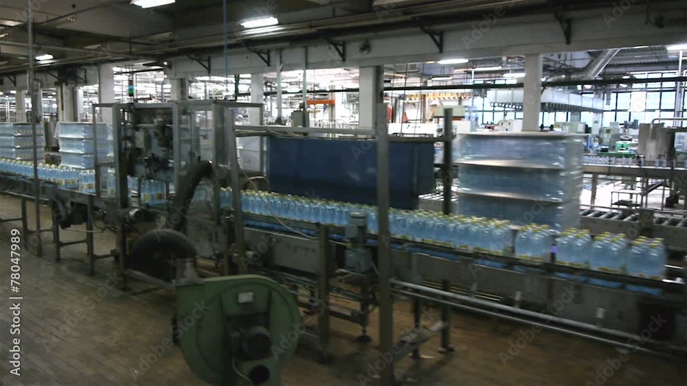 Flying over the production line in modern factory. Flying over the production line in modern factory.