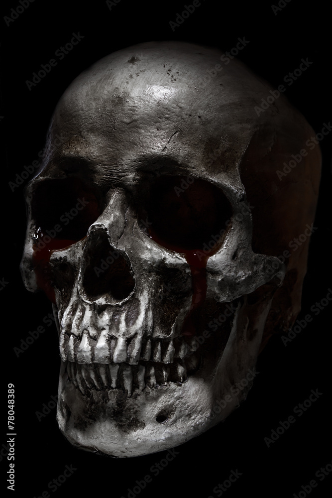 Obraz premium Scary human skull, crying blood
