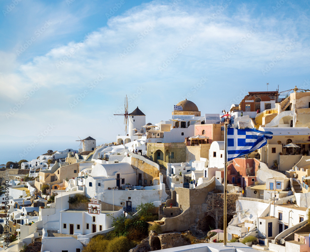 Windmills of Oia village at sunny day