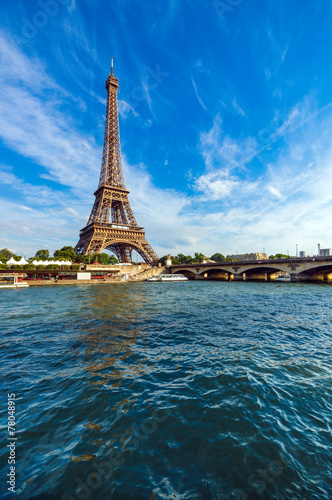 Eiffel Tower and Seine river with puffy clouds, Paris, France