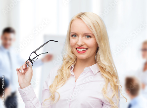 smiling businesswoman or secretary in office