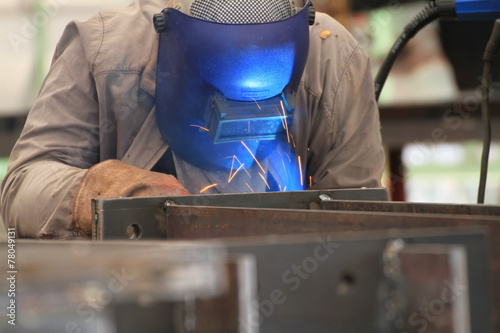 welder is welding the steel plate
