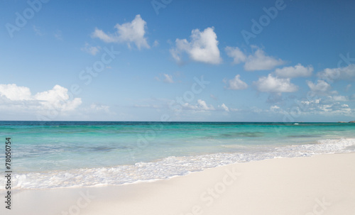 blue sea or ocean, white sand and sky with clouds © Syda Productions