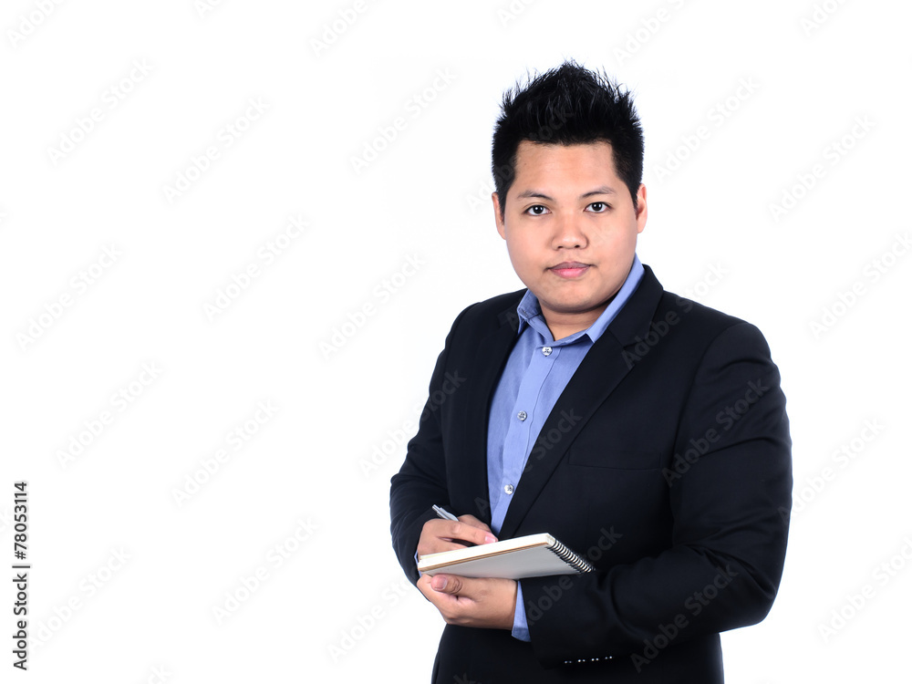 Young smiling Asian businessman taking notes isolated on a white Young smiling Asian businessman taking notes isolated on a white