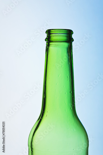 Wallpaper Mural Green crystal bottle against colorful background Torontodigital.ca