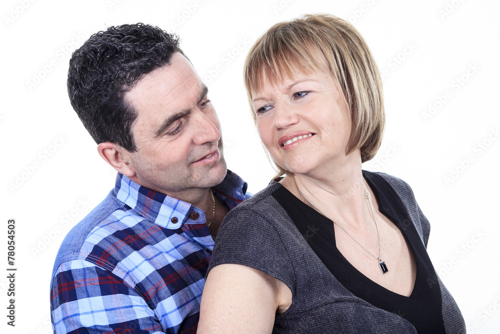 Studio portrait of happy seniors couple hugging. Isolated on whi Studio portrait of happy seniors couple hugging. Isolated on whi