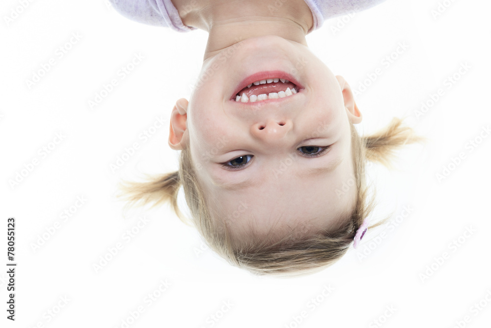 funny little girl hanging upside down on white Stock Photo | Adobe Stock