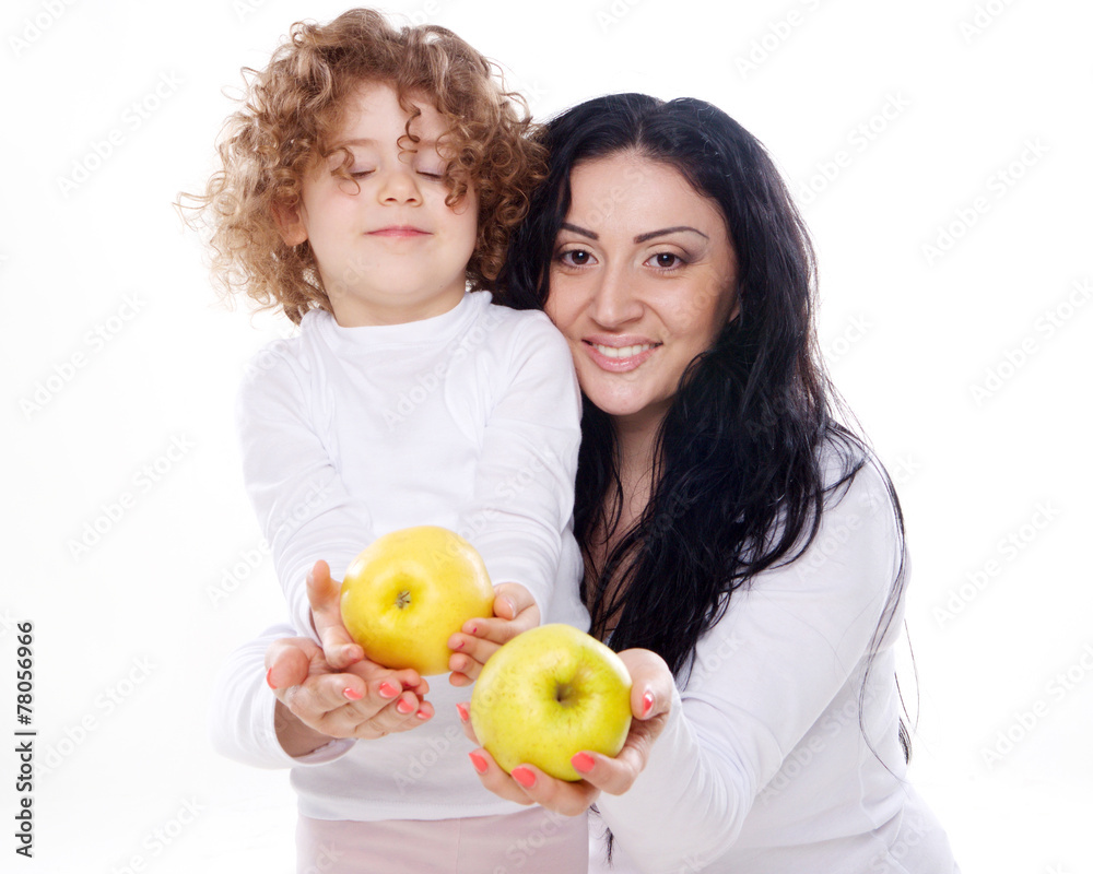 The child with mother holding apple isolated The child with mother holding apple isolated