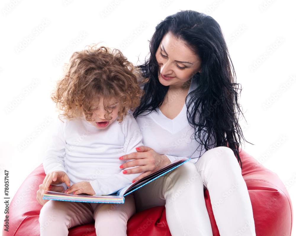 the child hold a book with mother isolated