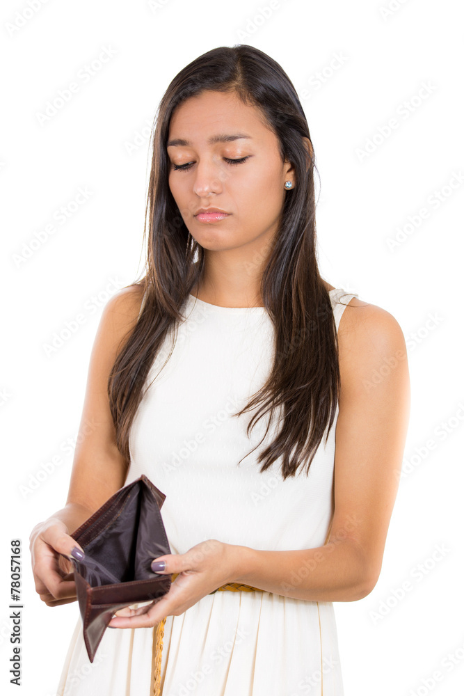 sad, unhappy young woman standing showing empty wallet sad, unhappy young woman standing showing empty wallet