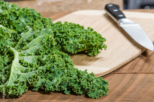 Green curly kale and knife