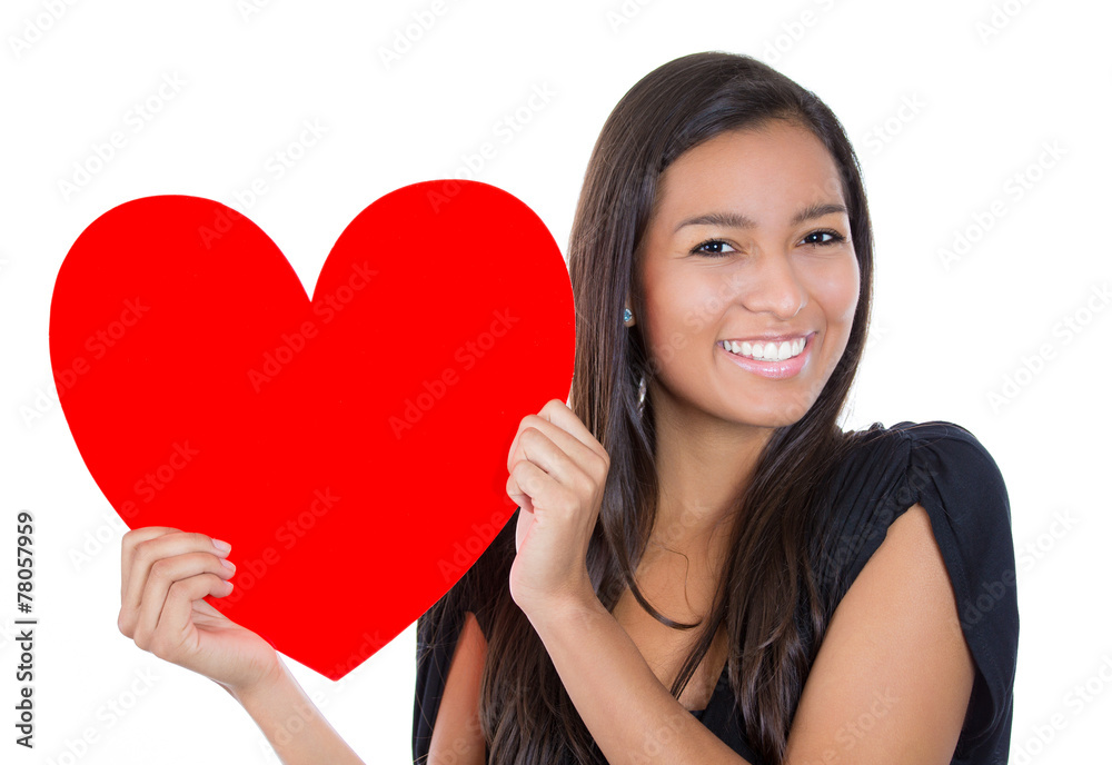 Beautiful young happy smiling woman holding red heart in love Beautiful young happy smiling woman holding red heart in love