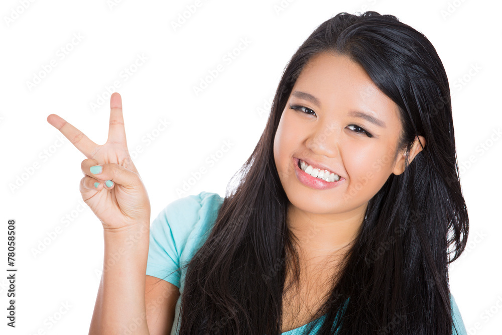 Portrait happy smiling woman showing victory peace sign Portrait happy smiling woman showing victory peace sign