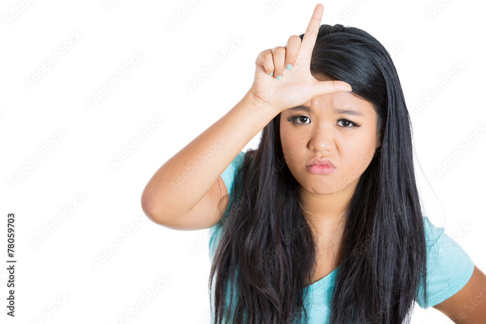 Young woman showing loser sing on white background Young woman showing loser sing on white background