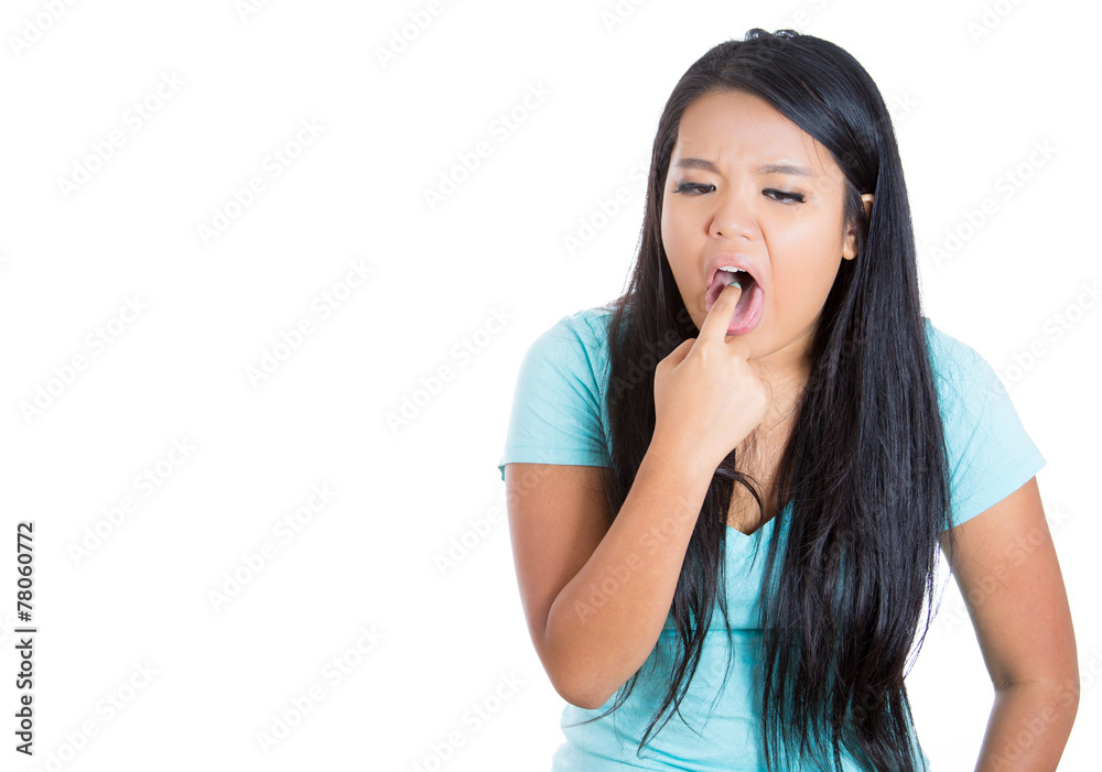 Woman disgusted finger in mouth gesture on white background Woman disgusted finger in mouth gesture on white background