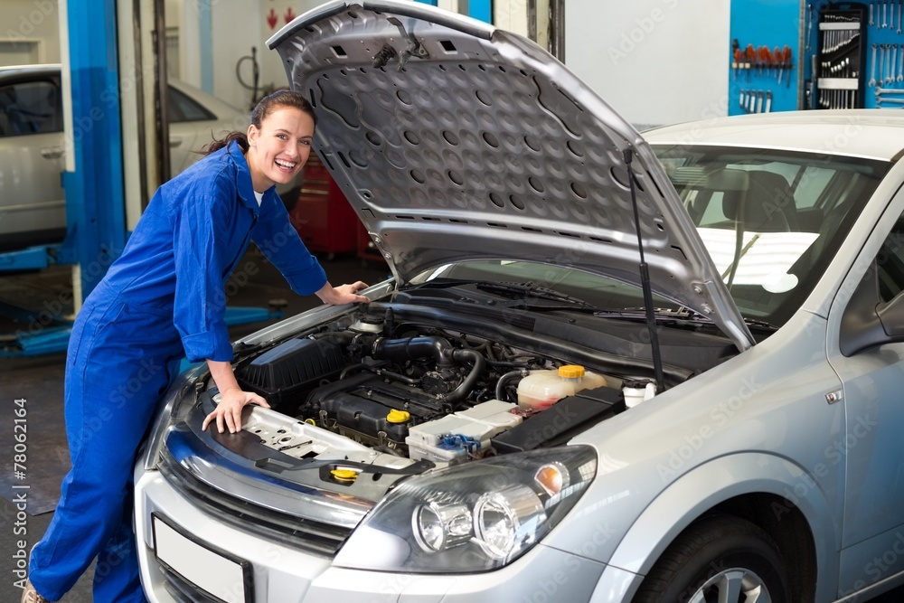 Smiling mechanic looking at camera Smiling mechanic looking at camera