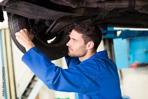 Mechanic adjusting the tire wheel