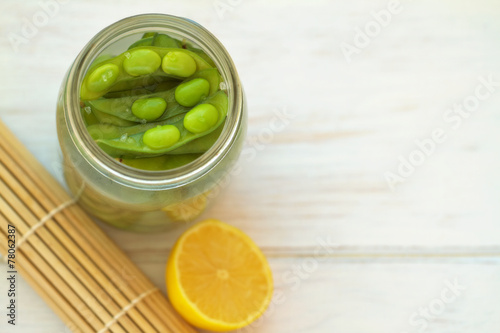 Edamame, soy beans on a vintage wooden background