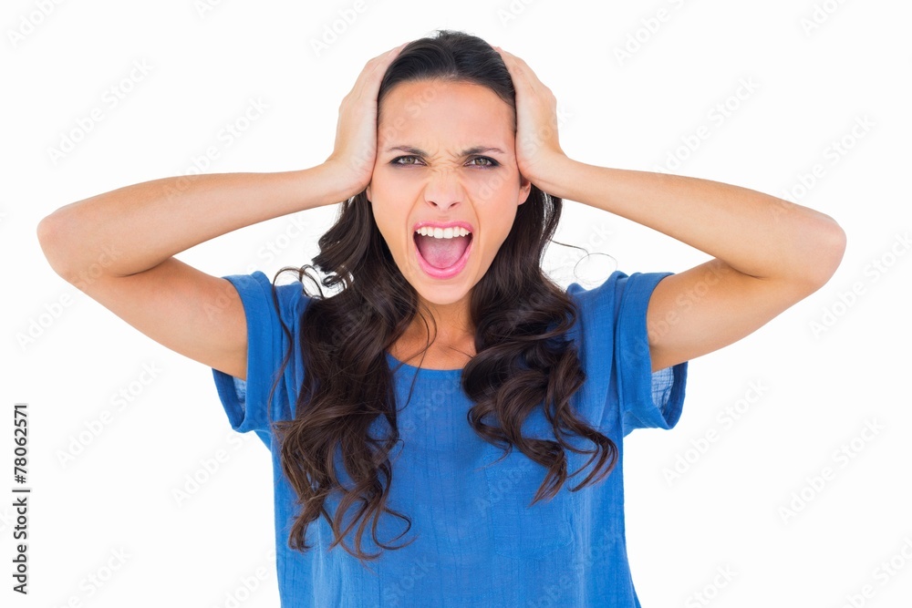 Angry brunette shouting at camera Angry brunette shouting at camera