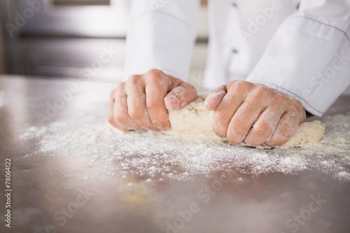 Принти на полотні Close up of baker preparing dough