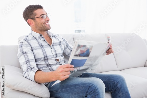 Smiling man with a newspaper