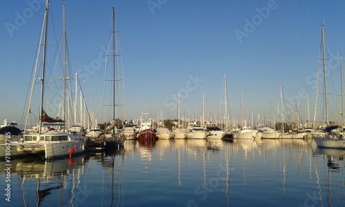 Yachts and sail boats reflected in a Marina © William Richardson