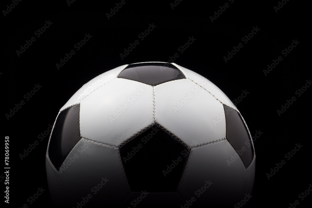 soccer ball on black background