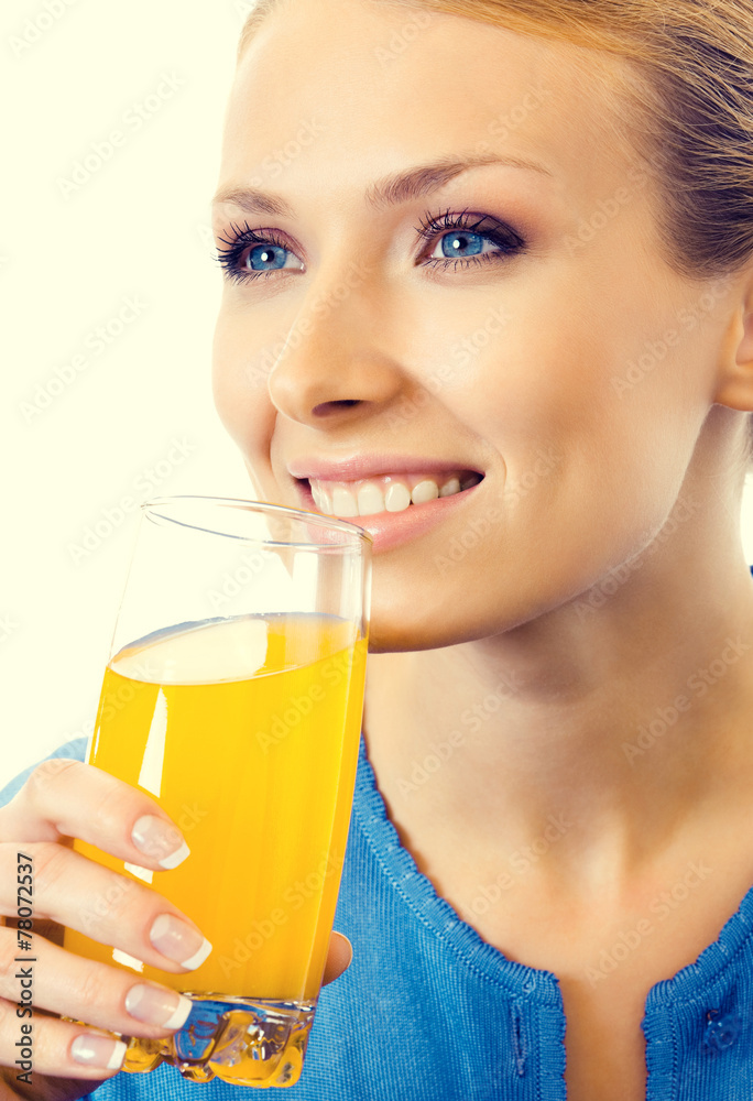 Portrait of young woman drinking orange juice Portrait of young woman drinking orange juice