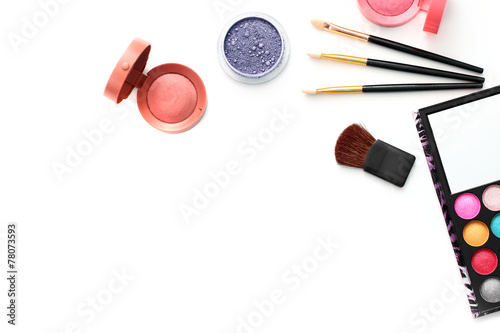make-up brushes and cosmetics isolated on white