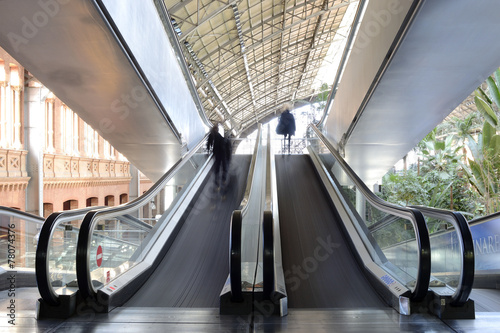 escalator with a few peolple photo