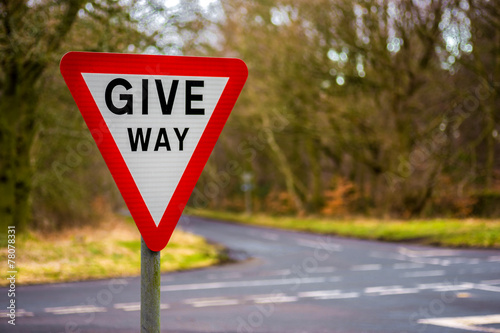 Give Way Uk Road sign with blurred background photo