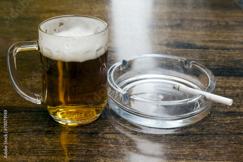 glass of beer and an ashtray