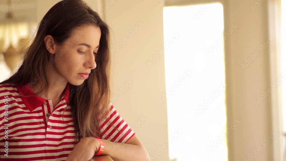 beautiful girl standing near the railing and looks down beautiful girl standing near the railing and looks down