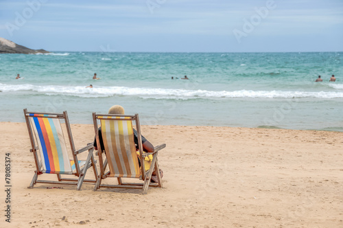 Man Sitting on Lounge Chair at the Beach in Brazil