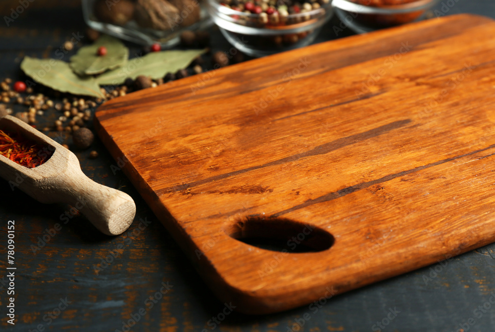 Different spices and herbs with cutting board Different spices and herbs with cutting board