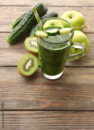 Green fresh healthy juice with fruits and vegetables