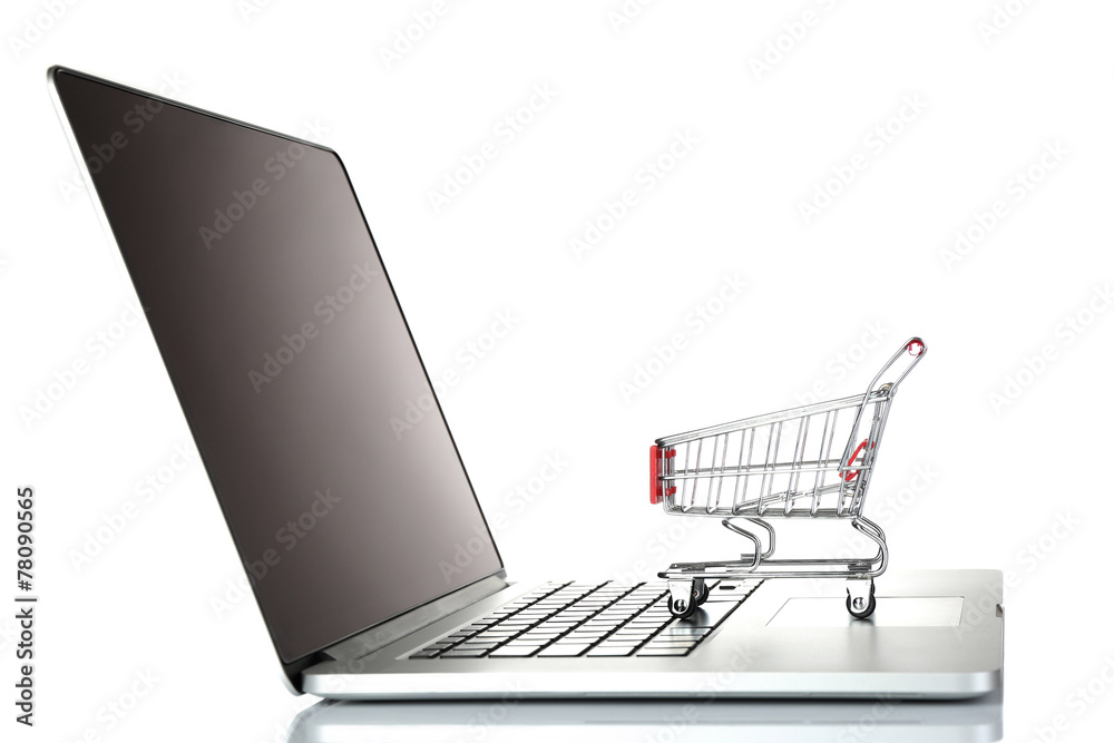 Laptop with small shopping cart isolated on white background Laptop with small shopping cart isolated on white background