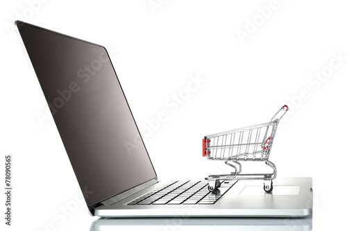 Laptop with small shopping cart isolated on white background