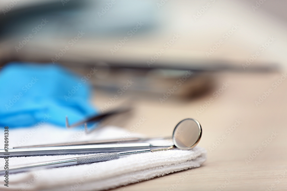 Set dentist tools on napkin on table close up Set dentist tools on napkin on table close up