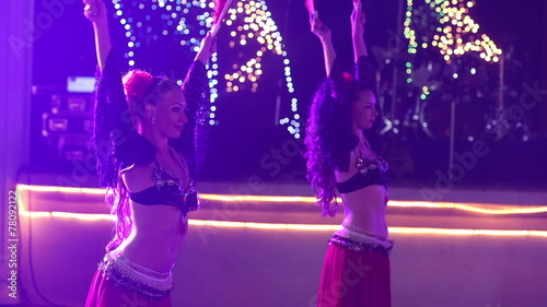 female dancers dancing in spanish costume at indian wedding part photo