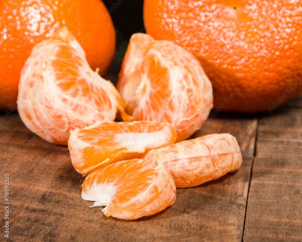 Tangelos and sections of fruit Tangelos and sections of fruit