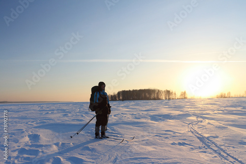 The skier going at sunset